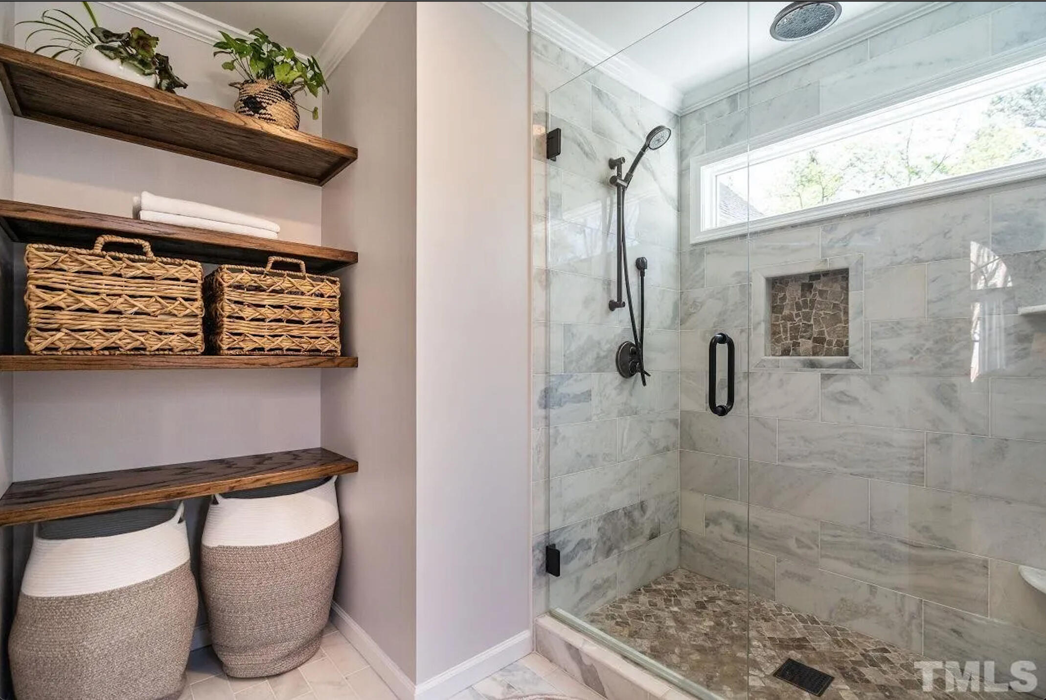 Classic navy, white trim, and brass accents turned this Cape into a standout. Simple, timeless updates with a big impact.