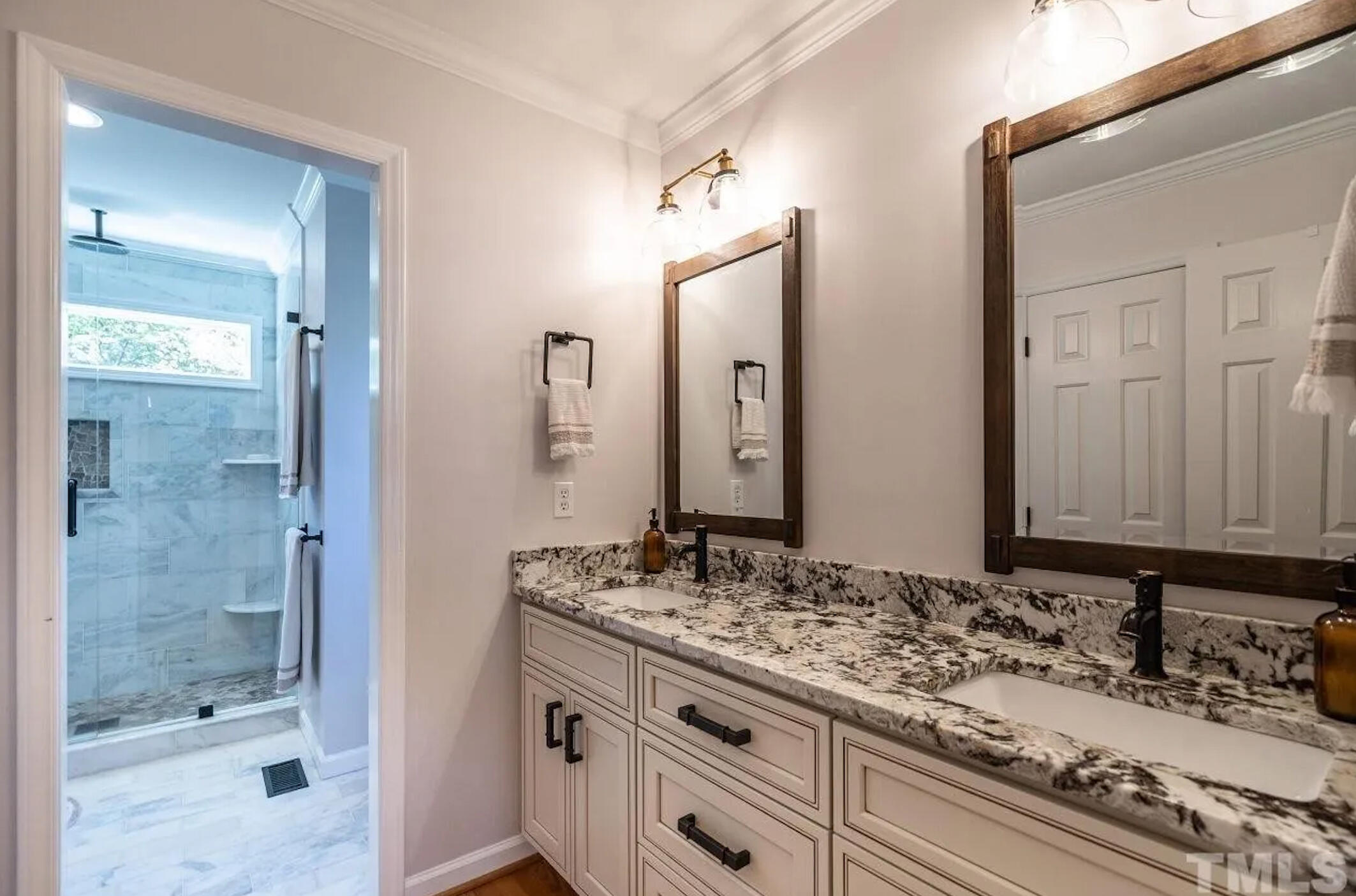 The client&#39;s goal was classic curb appeal with warmth and character. The Unstuck solution was navy siding, bright white trim, brass details, and natural wood for balance.