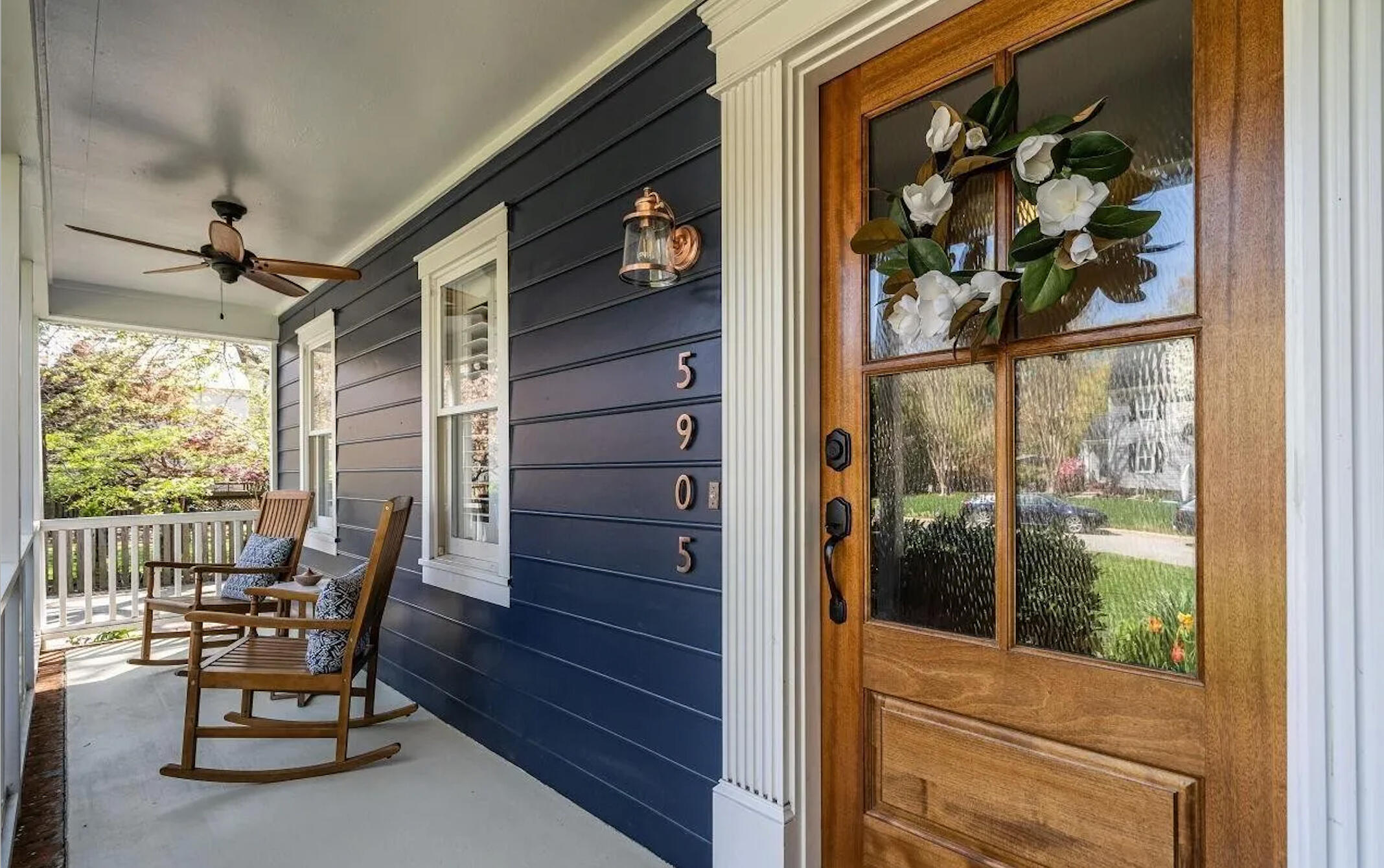This project made a splash without a large budget. Simple changes, big difference: fresh paint, warm brass, and natural wood details that make this porch feel like home again.